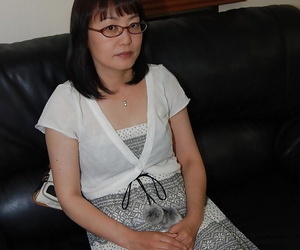Shy asian lady in glasses strips..
